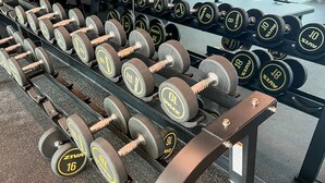 A rack of Zivah 16 kg dumbbells in a gym. - Sophisticated 2BR Missoni Home in Business Bays Prime Location (Dubai)