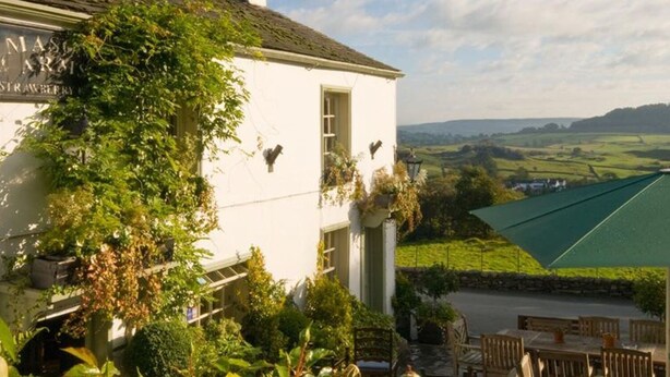 A white building with a sign reading "MASSARIS STRAWBERRY FARM". - Great Hartbarrow Farm Cottage (Windermere)