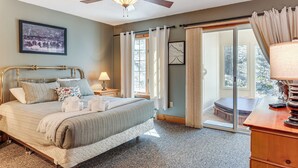 A bedroom with a bed, a ceiling fan, a window with curtains, a framed picture on the wall, and a view of the outdoors. - Access to Jack Frost Ski Resort: Home w/ Hot Tub (White Haven)