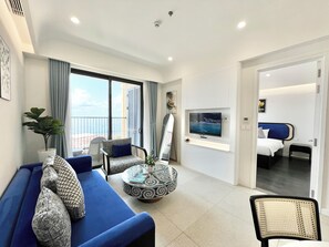 Luxury Apartment, Ocean View | Living area | 43-inch Smart TV with digital channels - Nice Seaview-Kiss bridge-Firework-Sunset (Phu Quoc)