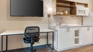 A compact kitchen with a flat-screen TV, a microwave, and a sink. - Extended Stay America Premier Suites - Yuma (Yuma)