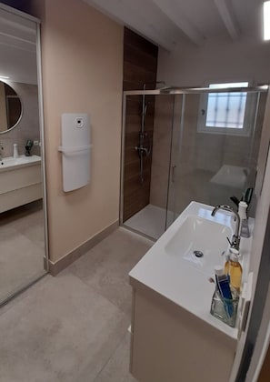 Shower, hair dryer, towels, soap