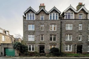 Traditional architecture with a symmetrical facade and pitched roof.