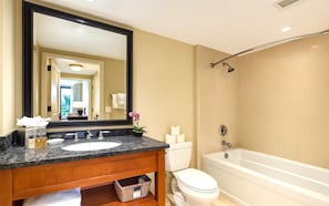 A bathroom with a sink, toilet, and bathtub. - Honua Kai | Ocean View 6 BR, Sleeps 20 | Car Incl. w/ 6+ Nights | HKH ML-1085 by KBM (Lahaina)