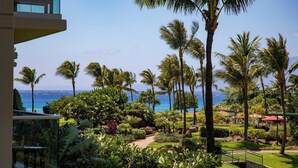 A resort with a view of the ocean, palm trees, and a well-maintained garden. - Honua Kai | Ocean View 6 BR, Sleeps 18 | Car Incl. w/ 6+ Nights | HKH ML-1111 by KBM (Lahaina)