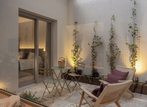 Executive Suite, Courtyard View | Down comforters, memory foam beds, in-room safe, individually decorated - Can Verí Suites (Soller)