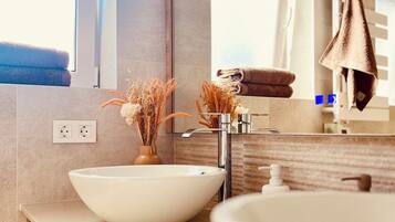 Shower, hair dryer, towels, soap