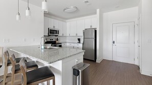 Fridge, dining tables - Landing | Spectacular 2BD, Pool, Yoga Studio (Athens)