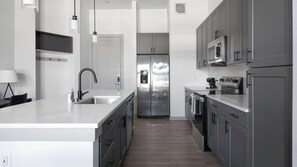 Fridge, dining tables - Landing | Spectacular 1BD, Courtyard, Game Room (Austin)