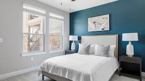 A bedroom with a bed, two bedside tables, a window, and a wall-mounted artwork. - Landing | Spectacular 1BD, Clubhouse, Game Room (Allen)