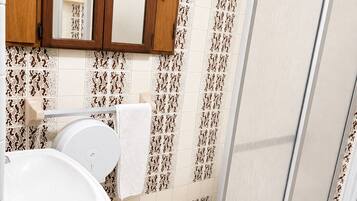 Shower, rainfall showerhead, towels, soap