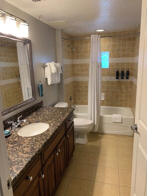 Shower, jetted tub, hair dryer, towels