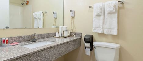 Bathtub, towels, soap, shampoo