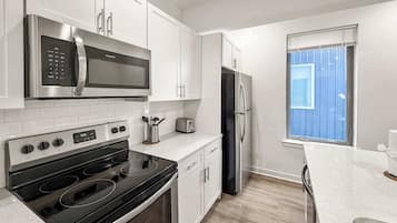 Coffee/tea maker, fridge, microwave, oven