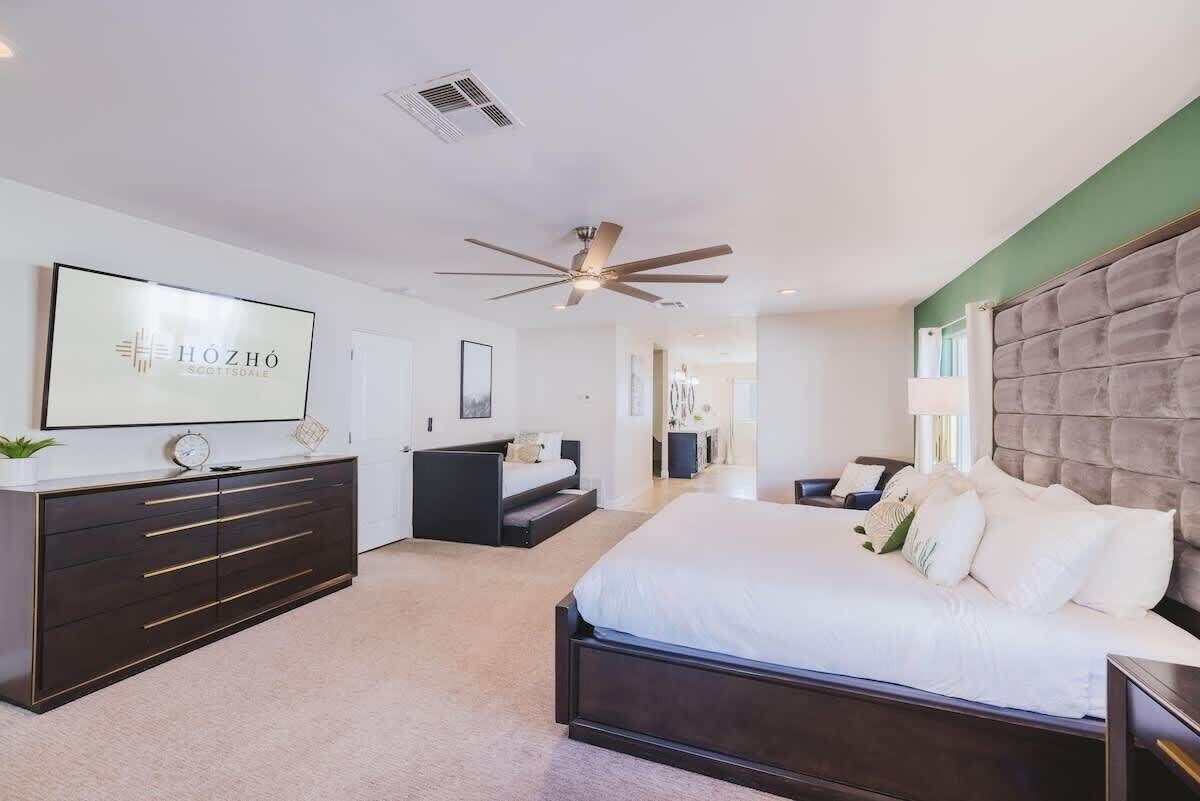 Bedroom One | The Luxe Retreat | The master bedroom opens right to the pool —grab your coffee and step outside in seconds.