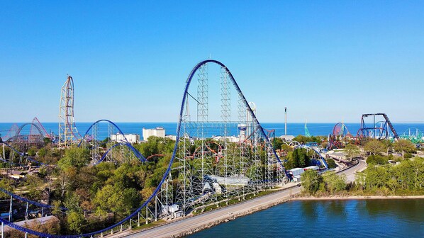 Experience the thrill of a coastal amusement park with a variety of roller coasters and attractions.