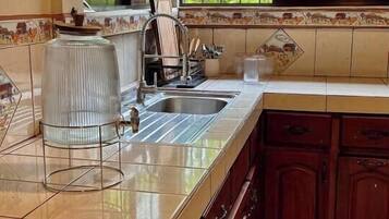 Microwave, stovetop, coffee/tea maker, cookware/dishes/utensils