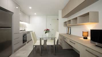 Apartment, 1 Queen Bed | Living area | Flat-screen TV