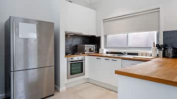 House, Multiple Beds | Private kitchen