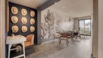 Superior Apartment | Living area | 55-inch Smart TV with satellite channels