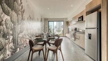 Superior Apartment | Living area | 55-inch Smart TV with satellite channels