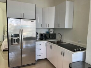 Fridge, microwave, stovetop, coffee/tea maker