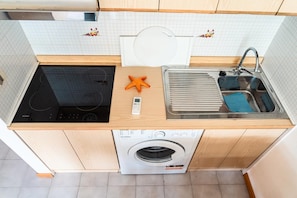 Fridge, microwave, highchair, cookware/dishes/utensils