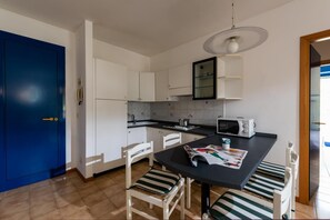 Fridge, microwave, highchair, cookware/dishes/utensils