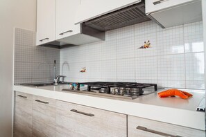 Fridge, microwave, highchair, cookware/dishes/utensils