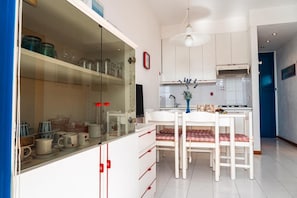 Fridge, microwave, highchair, cookware/dishes/utensils