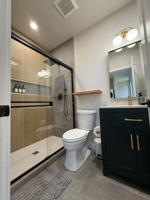 Shower, hair dryer, towels, soap