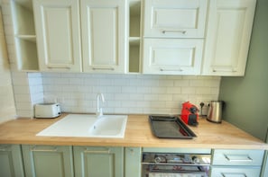 Fridge, oven, coffee/tea maker, toaster