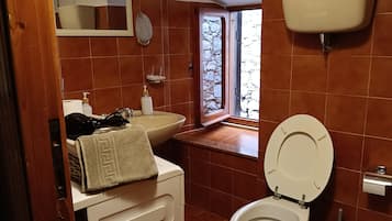 Hair dryer, bidet, towels, soap