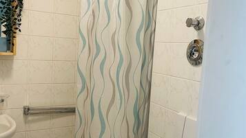 Shower, towels, soap, toilet paper