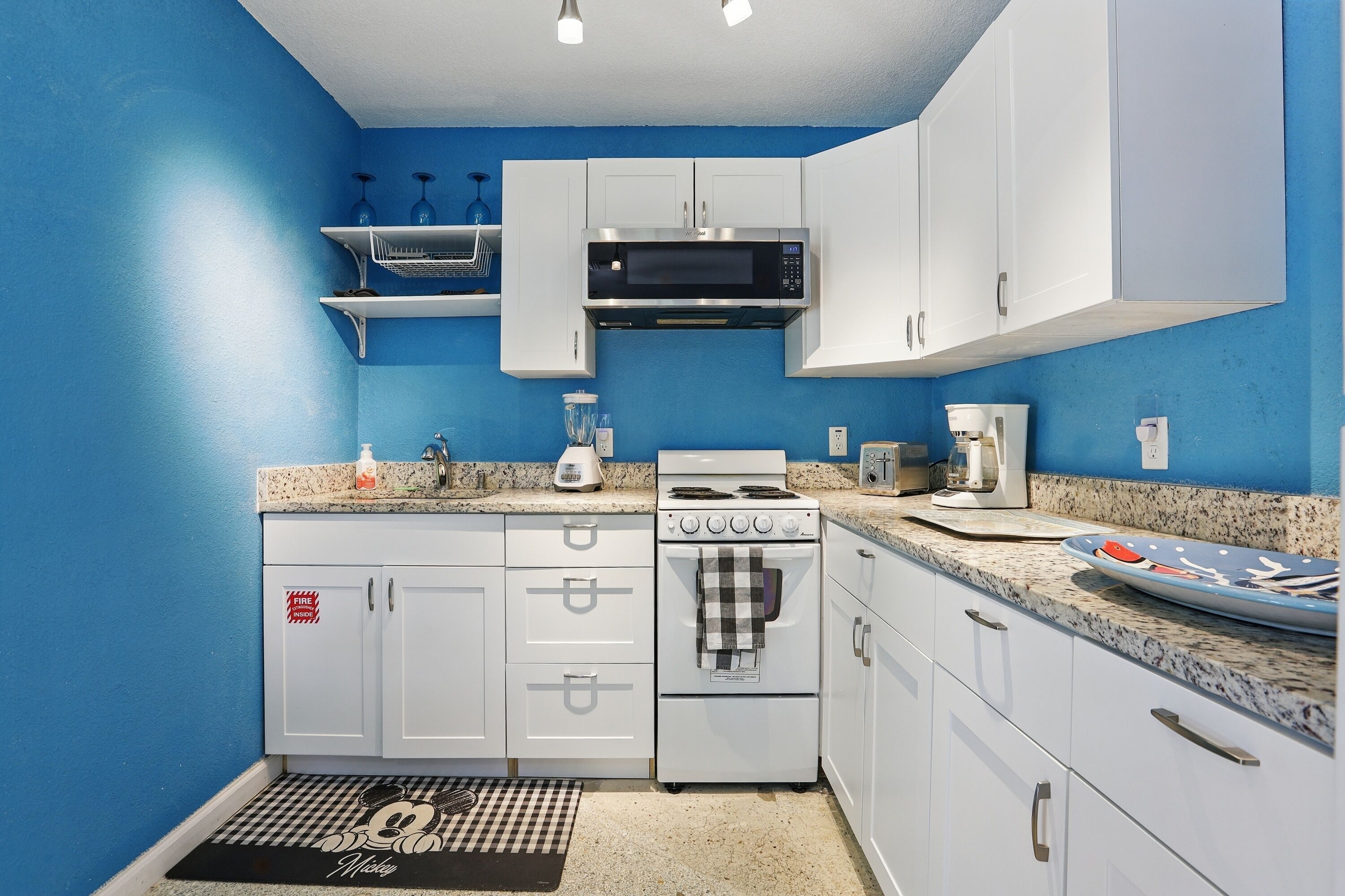 Microwave, toaster, dining tables