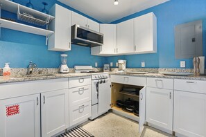 Microwave, toaster, dining tables