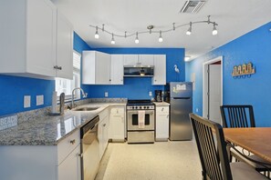 Microwave, toaster, dining tables