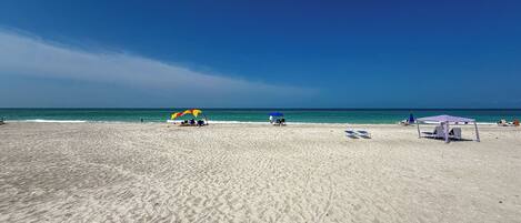 On the beach, sun-loungers, beach towels