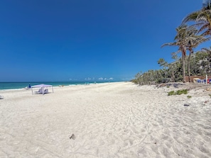 On the beach, sun loungers, beach towels