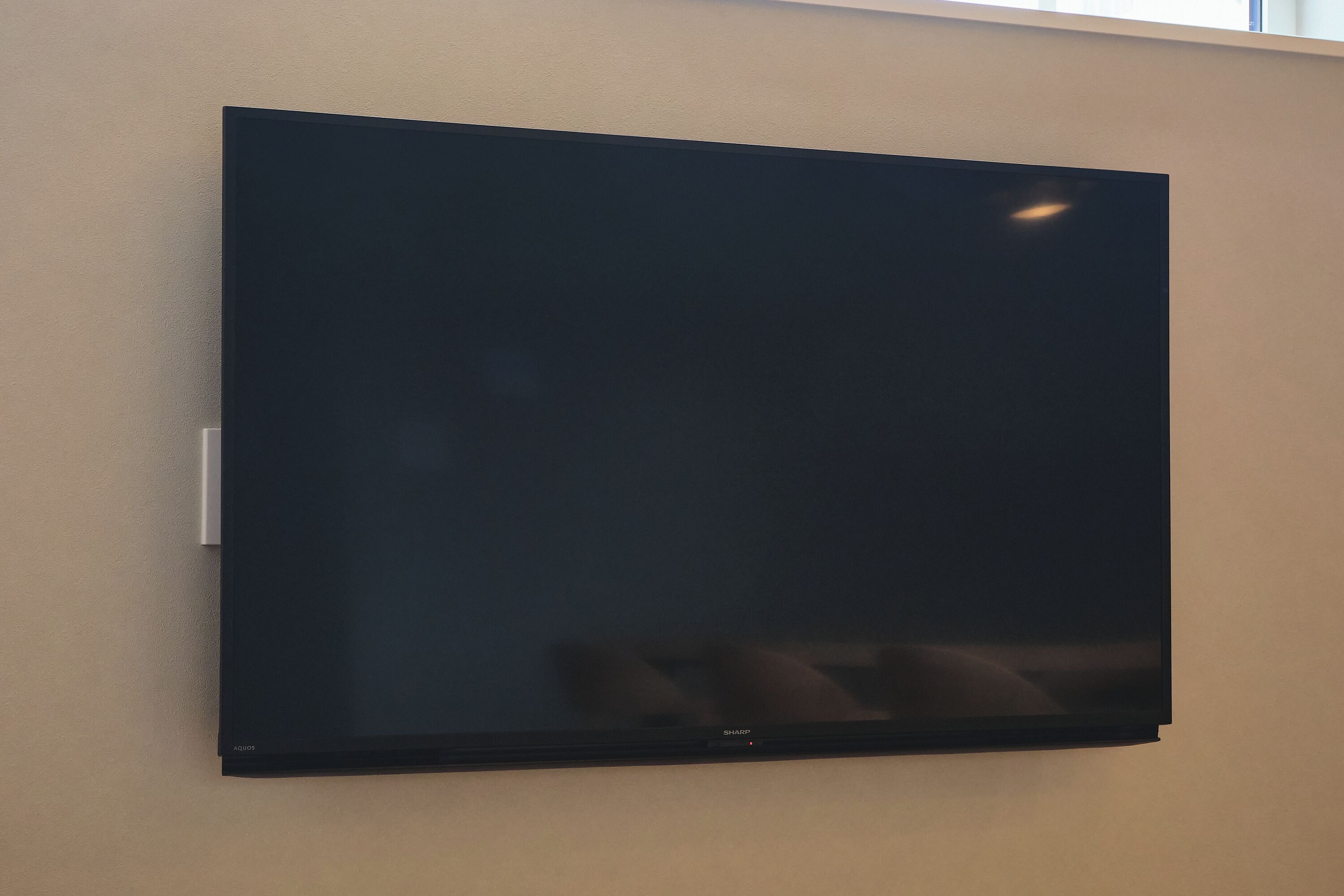 A flat-screen TV mounted on a wall.