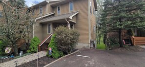 Stroll up the covered porch to the entrance of this charming home.
