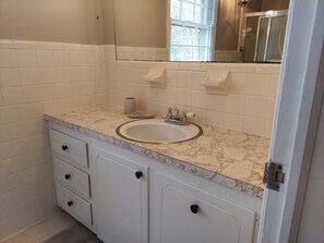 Shower, hair dryer, towels, soap