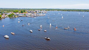A harbor with numerous boats and a town in the background. - Cozy home in Vinkeveen with sauna (Vinkeveen)