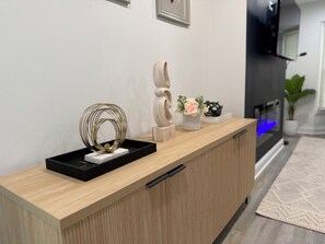 Welcome to our reception area, featuring a stylish console table and comfortable living space.