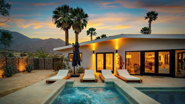 A modern house with a swimming pool, lounge chairs, and a desert landscape in the background. - Palm Springs Haven / Pool, Hot Tub & Mountain Views (Palm Springs)