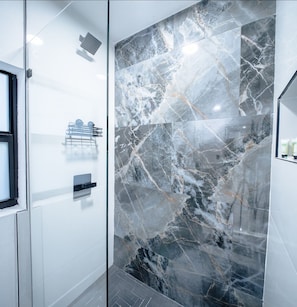 Shower, hair dryer, towels, soap