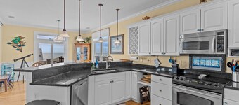Experience ocean views at Beach Bubbles, a spacious 5-bedroom, 4-bathroom home in Oak Island