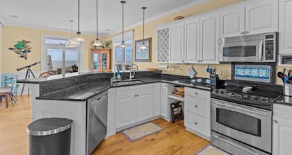Experience ocean views at Beach Bubbles, a spacious 5-bedroom, 4-bathroom home in Oak Island