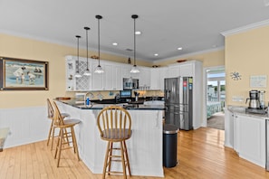 Fridge, microwave, oven, stovetop - Experience ocean views at Beach Bubbles, a spacious 5-bedroom, 4-bathroom home in Oak Island (Oak Island)