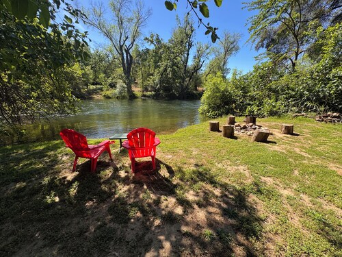 Rustic cozy cabin on rivers edge